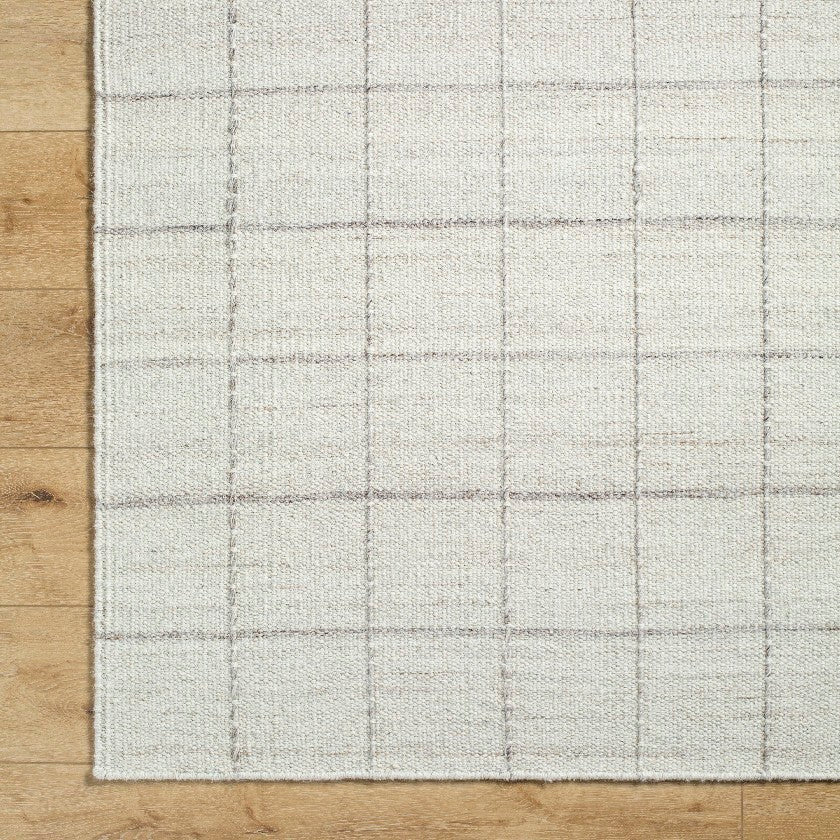 Ishaq Solid and Border Ivory Area Rug