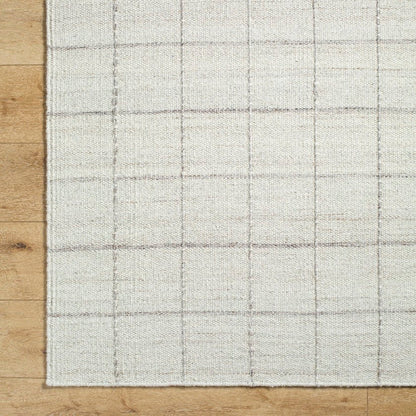 Ishaq Solid and Border Ivory Area Rug