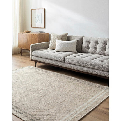 Janmichael Solid and Border Light Beige Area Rug