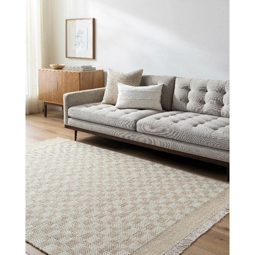 Clinten Solid and Border Tan Area Rug – qorux