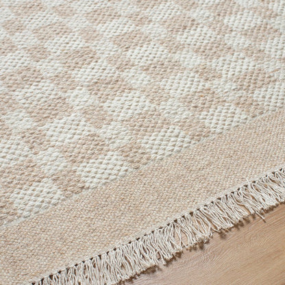 Clinten Solid and Border Tan Area Rug