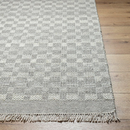 Clinten Solid and Border Ivory Area Rug