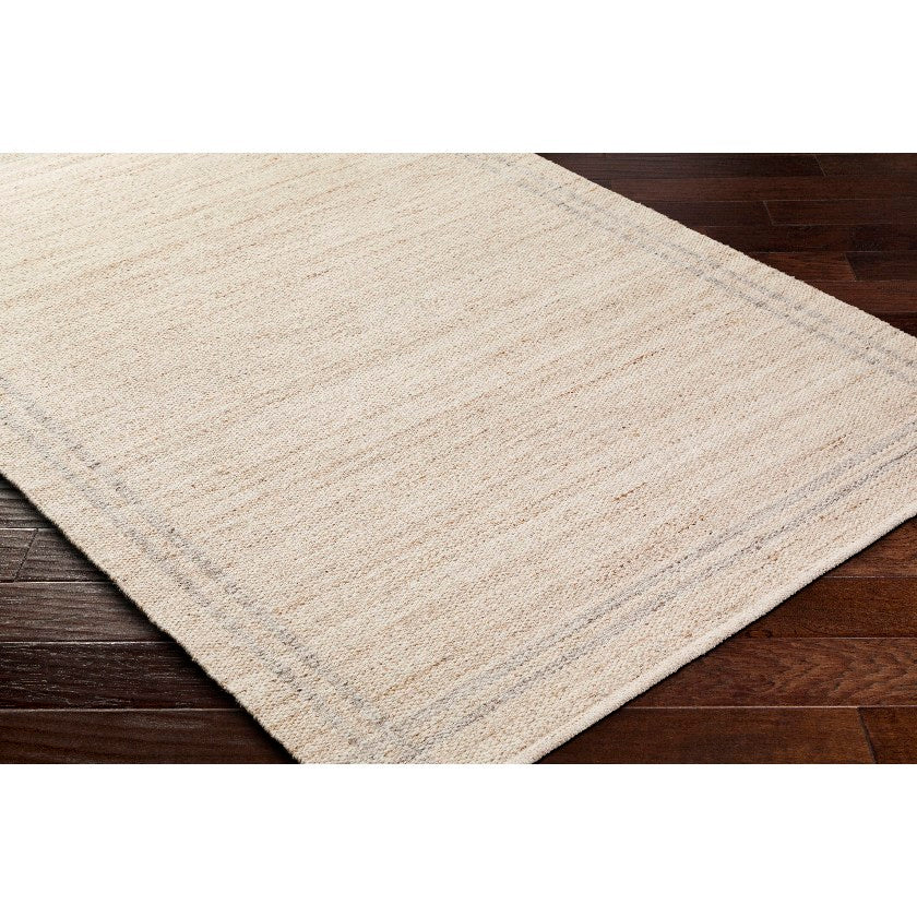 Janmichael Solid and Border Tan Area Rug