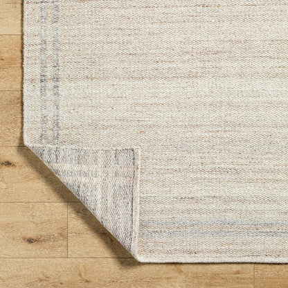 Janmichael Solid and Border Tan Area Rug