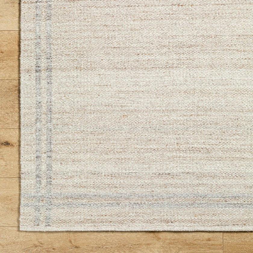 Janmichael Solid and Border Tan Area Rug